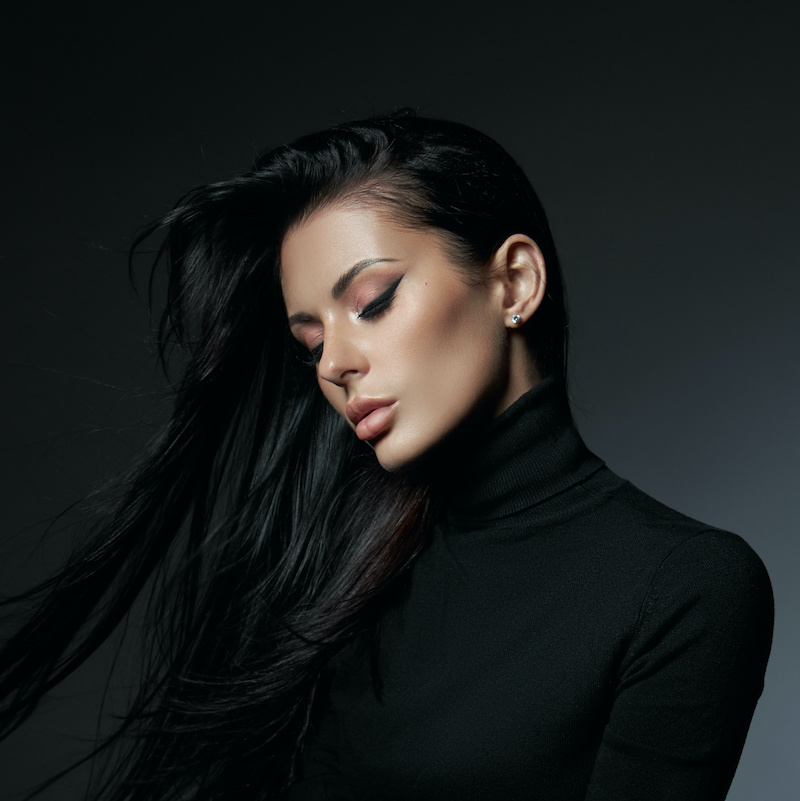 brow lift beautiful young woman in black turtle neck