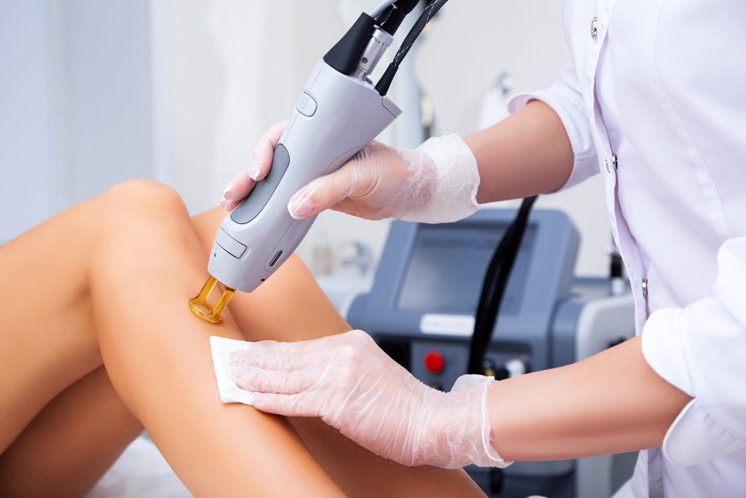 Close up of a female cosmetologist in a medical coat making a yo